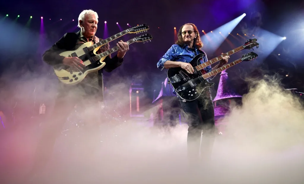 Rush performs at the United Center in Chicago during a comeback concert with a tribute to Neil Peart