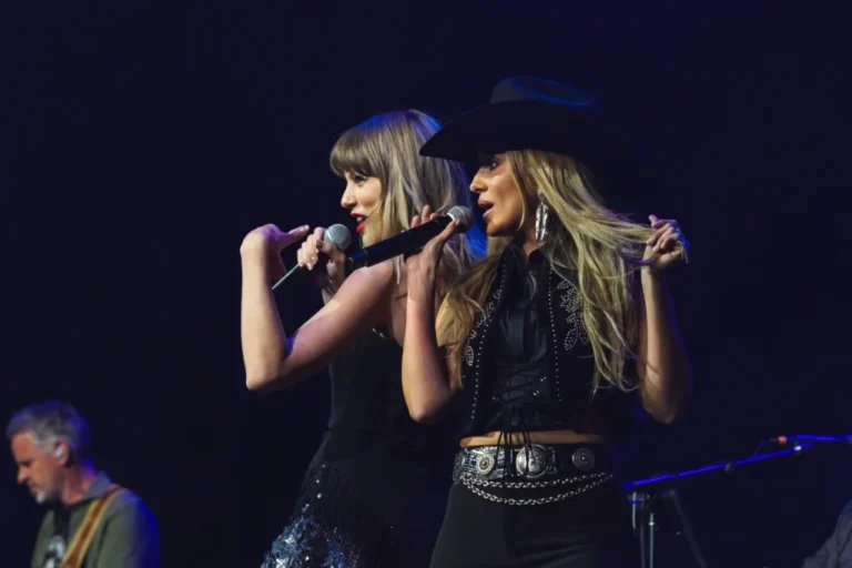 Taylor Swift performs with Lainey Wilson during the Tight Ends & Friends concert in Nashville