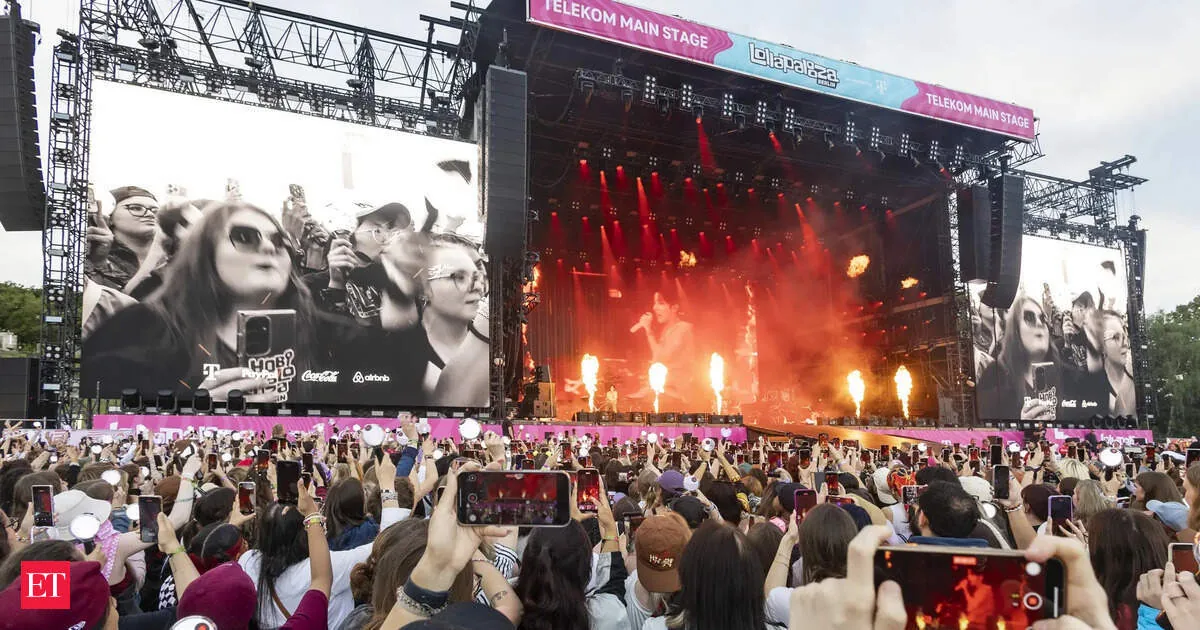 Crowds and stage lights at Lollapalooza in Chicago's Grant Park