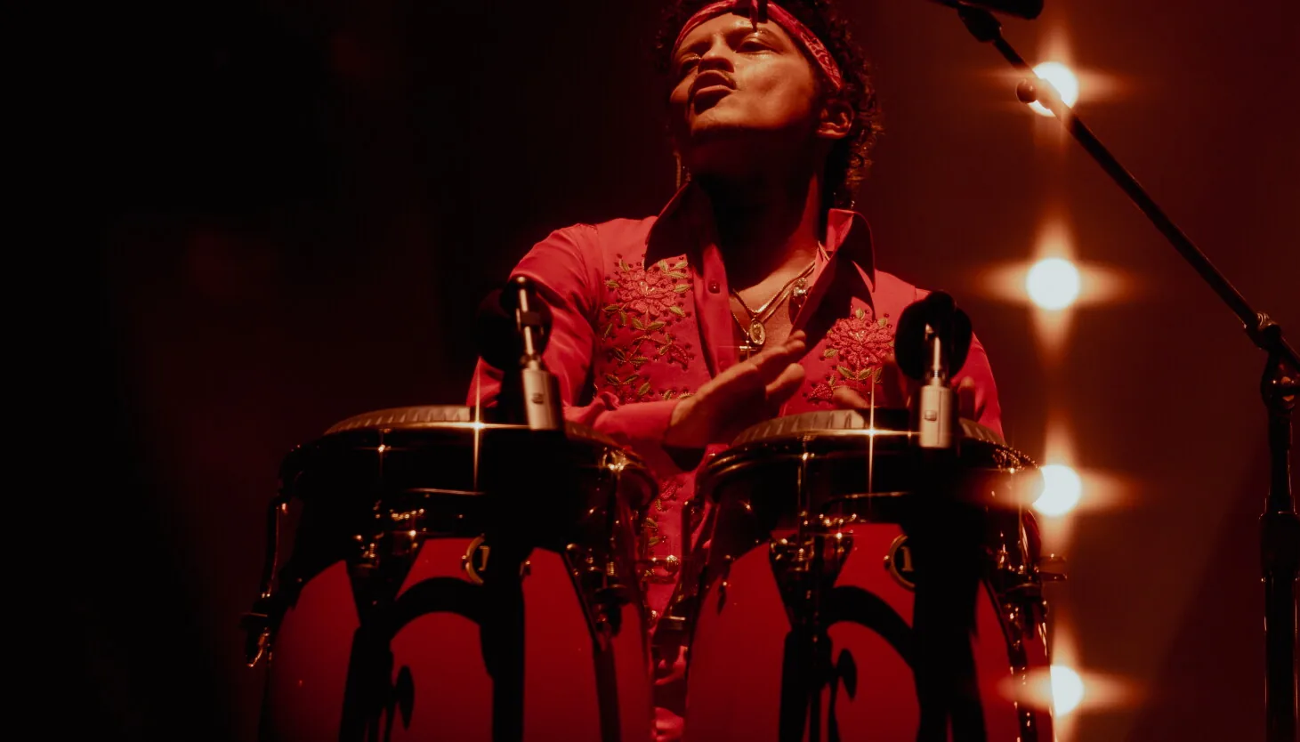 Bruno Mars performs in a red suit before a sold-out crowd at Soldier Field in Chicago