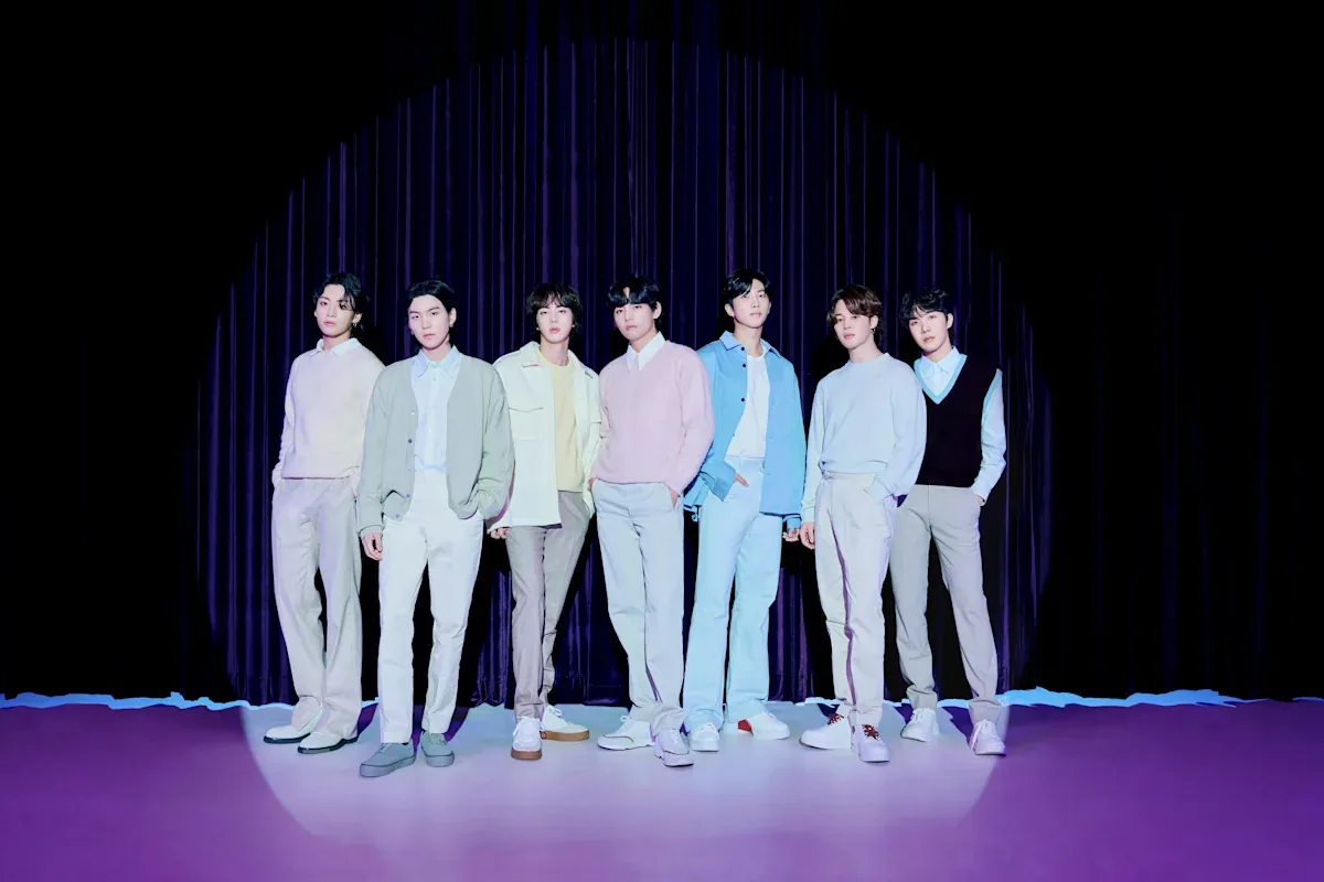 BTS performing on a stadium stage during its 2026 world tour