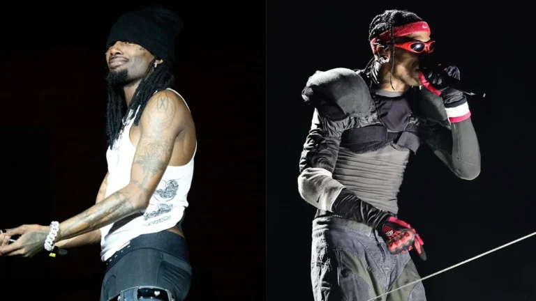 Playboi Carti performing onstage at Soldier Field with Travis Scott during a Chicago concert