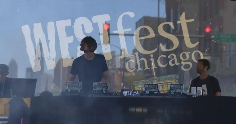 Crowds gather at a Chicago street festival with food vendors, music and colorful tents