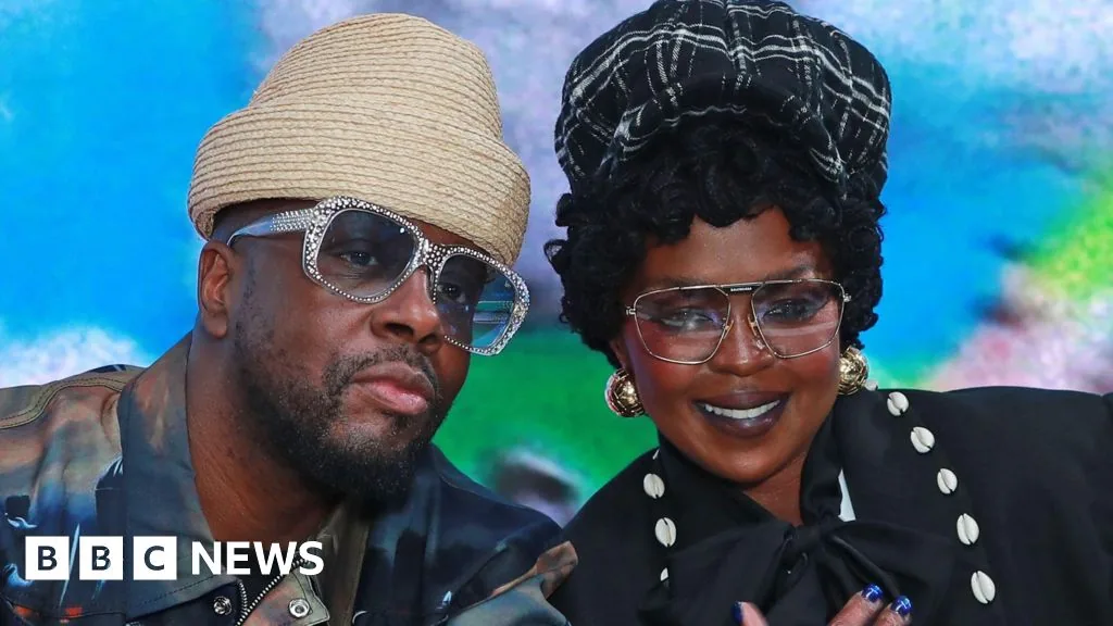 Lauryn Hill and Wyclef Jean speaking together ahead of a Fugees anniversary event