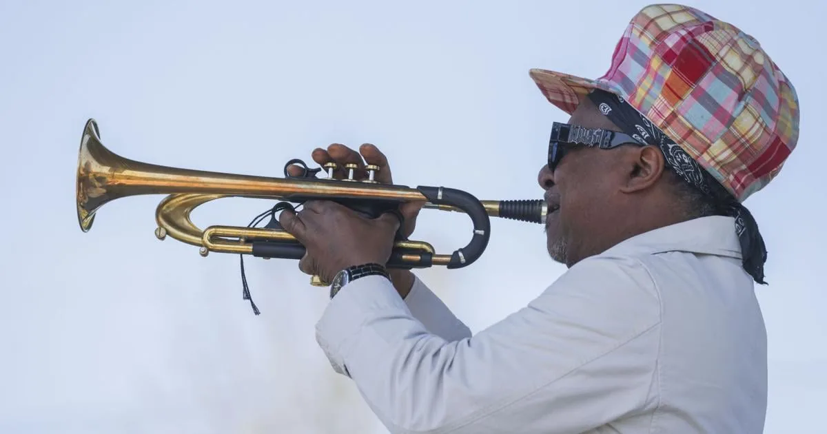 Live music playing at a New Orleans venue with brass instruments and a crowd