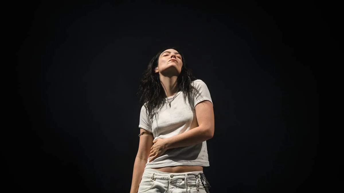 Lorde performs at Lollapalooza in Chicago with Charli XCX joining her onstage for a surprise reunion