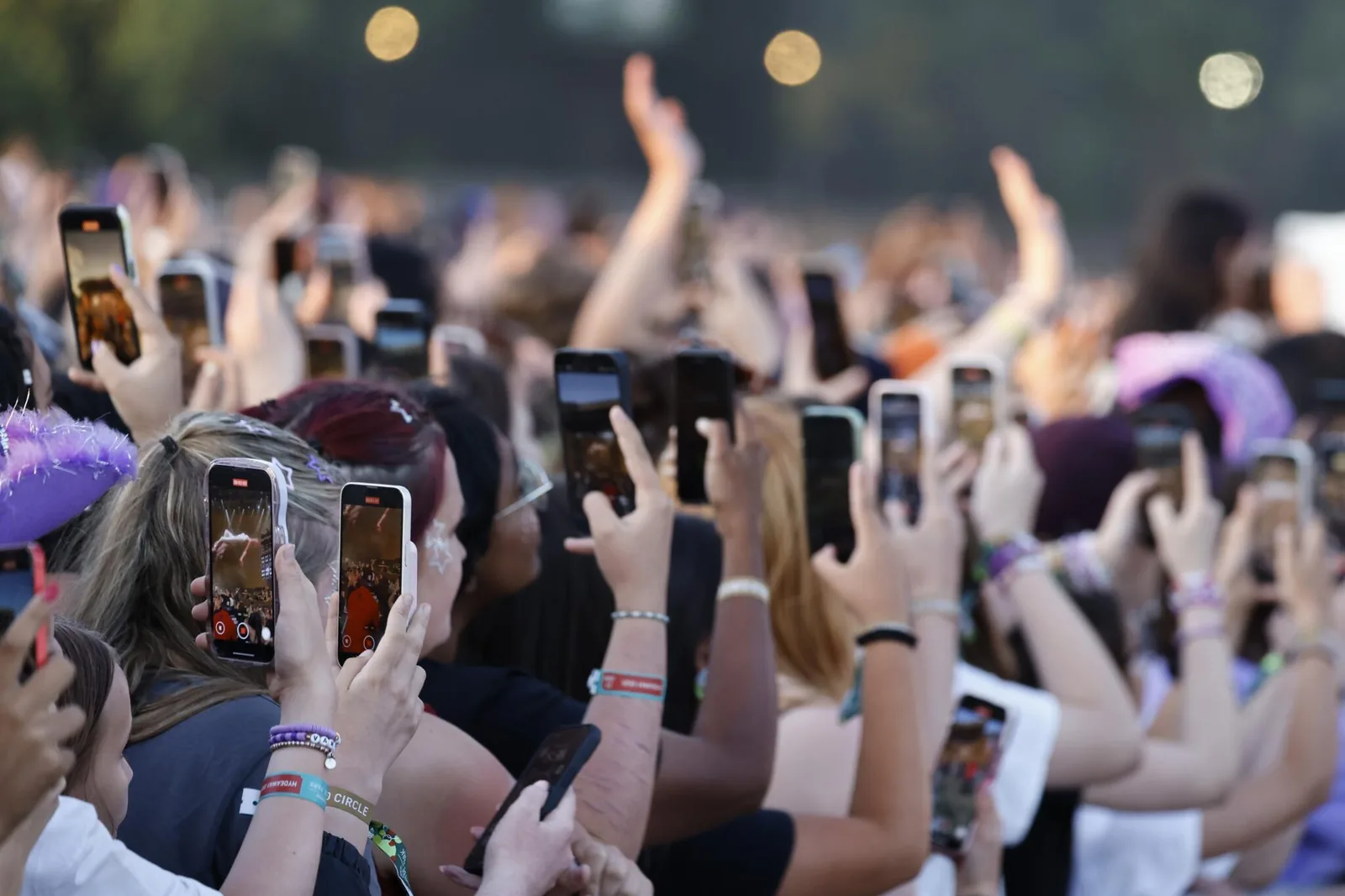 Concertgoers packed tightly in a general admission floor section near the stage