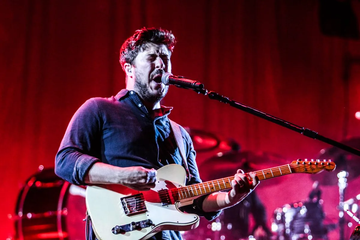 Mumford & Sons performing onstage at Madison Square Garden during the Prizefighter tour