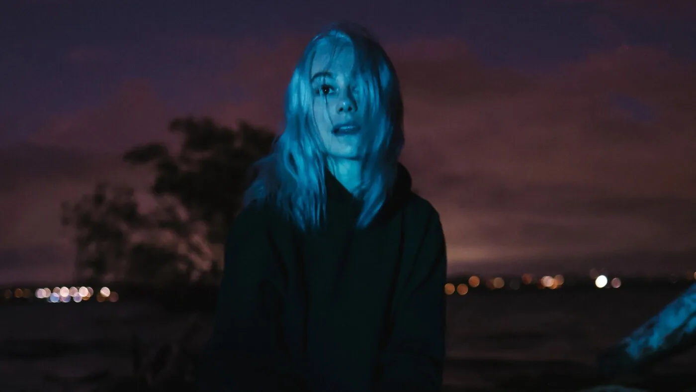 Phoebe Bridgers posing for a solo album review feature