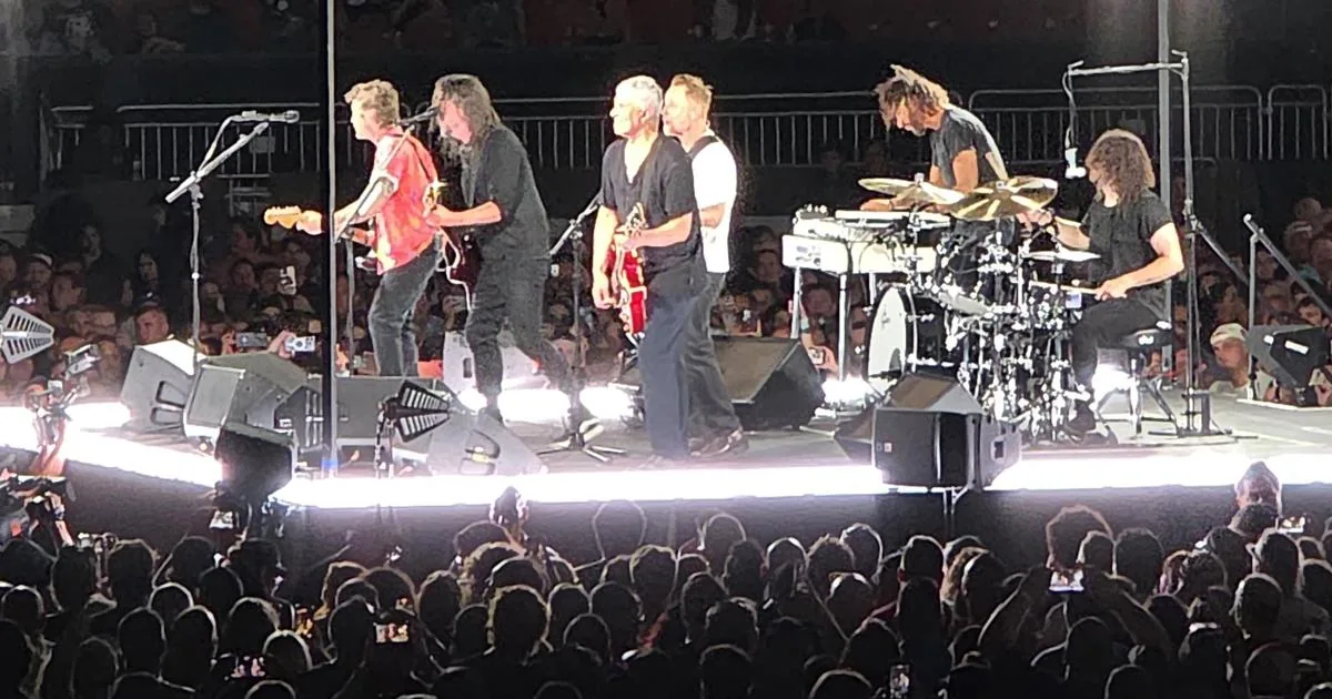 Foo Fighters performing at Huntington Bank Field in Cleveland before a packed stadium crowd