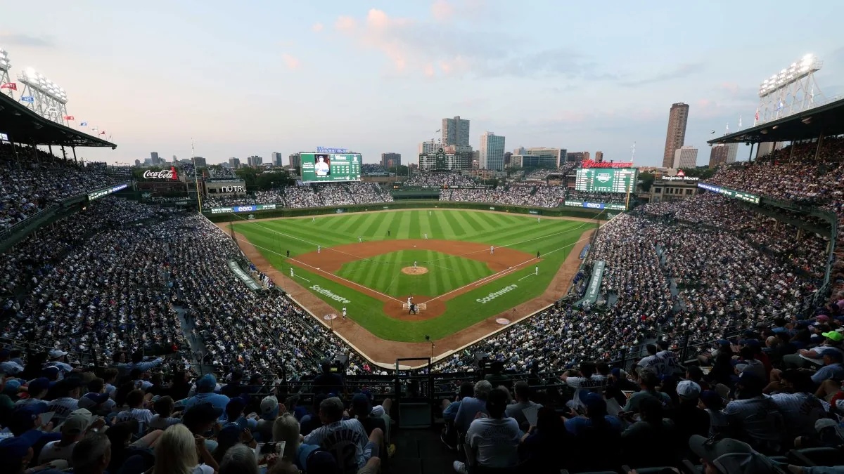 Fans at Wrigley Field during a Chicago Cubs game with playoff ticket lottery details