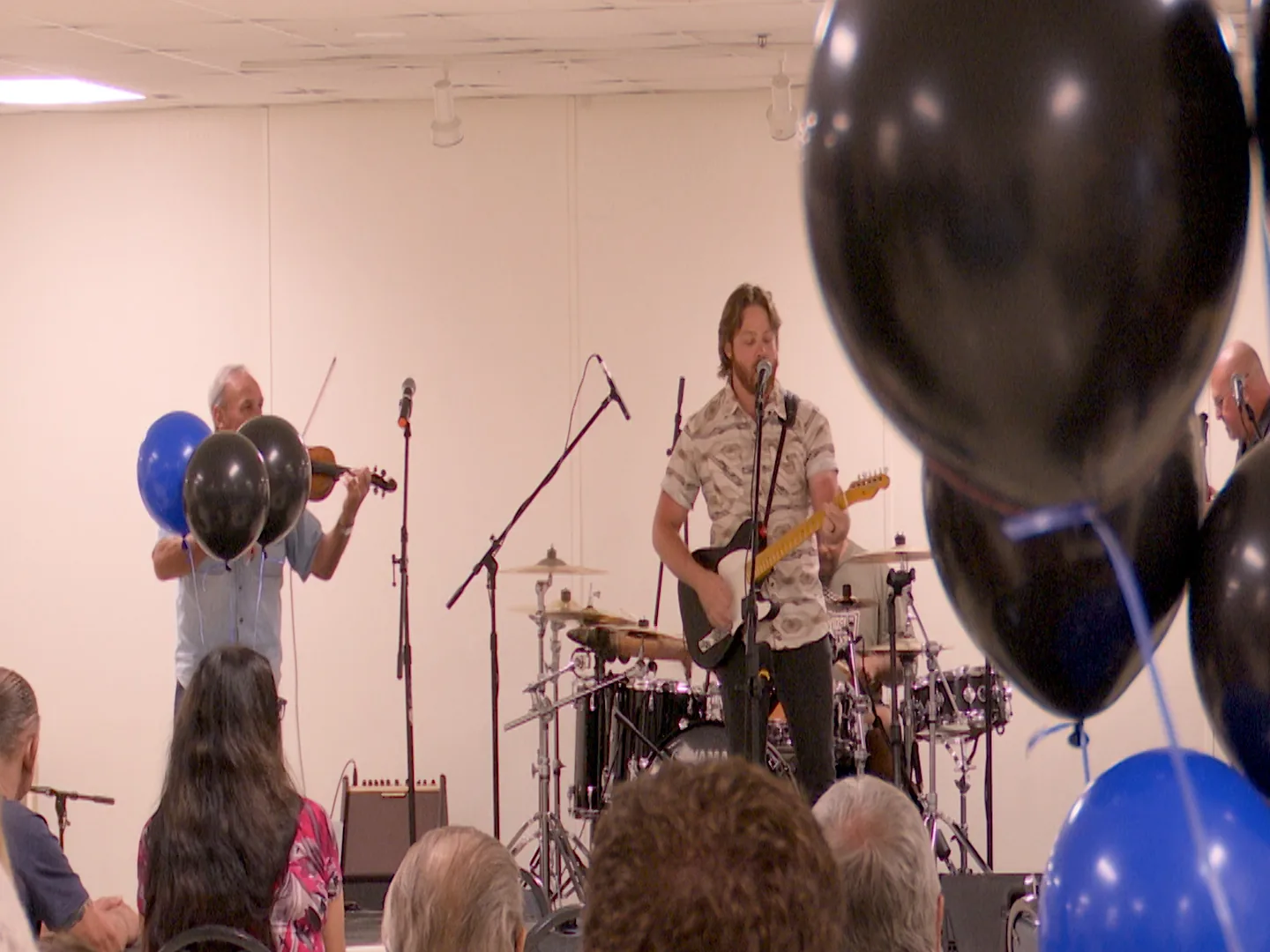 Local musicians perform at a benefit concert to support a fellow artist battling cancer