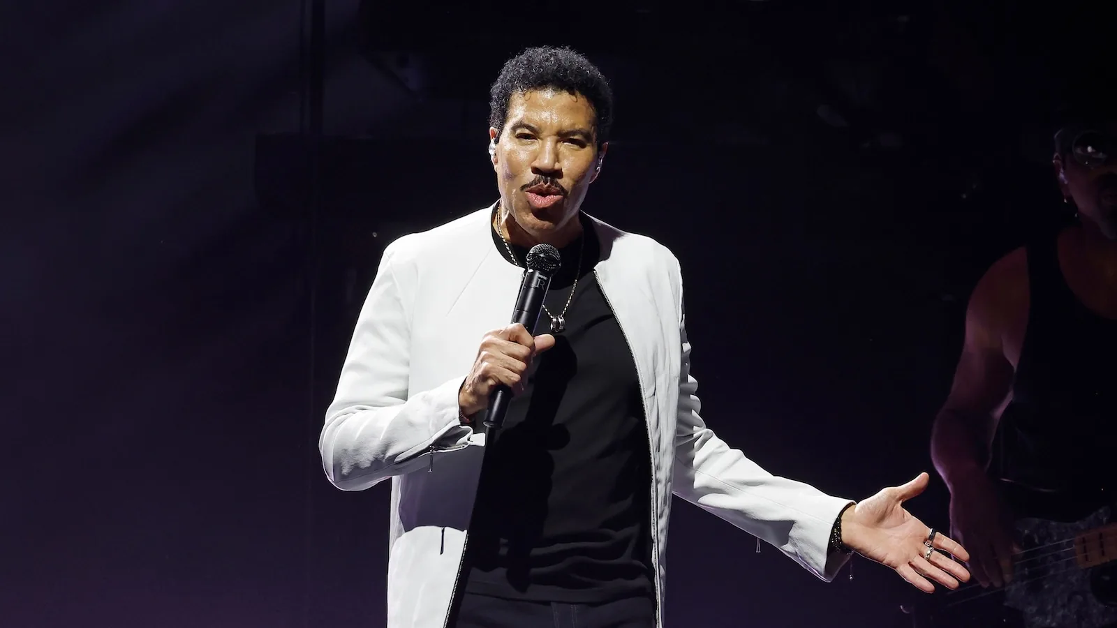 Lionel Richie performing onstage during a concert tour