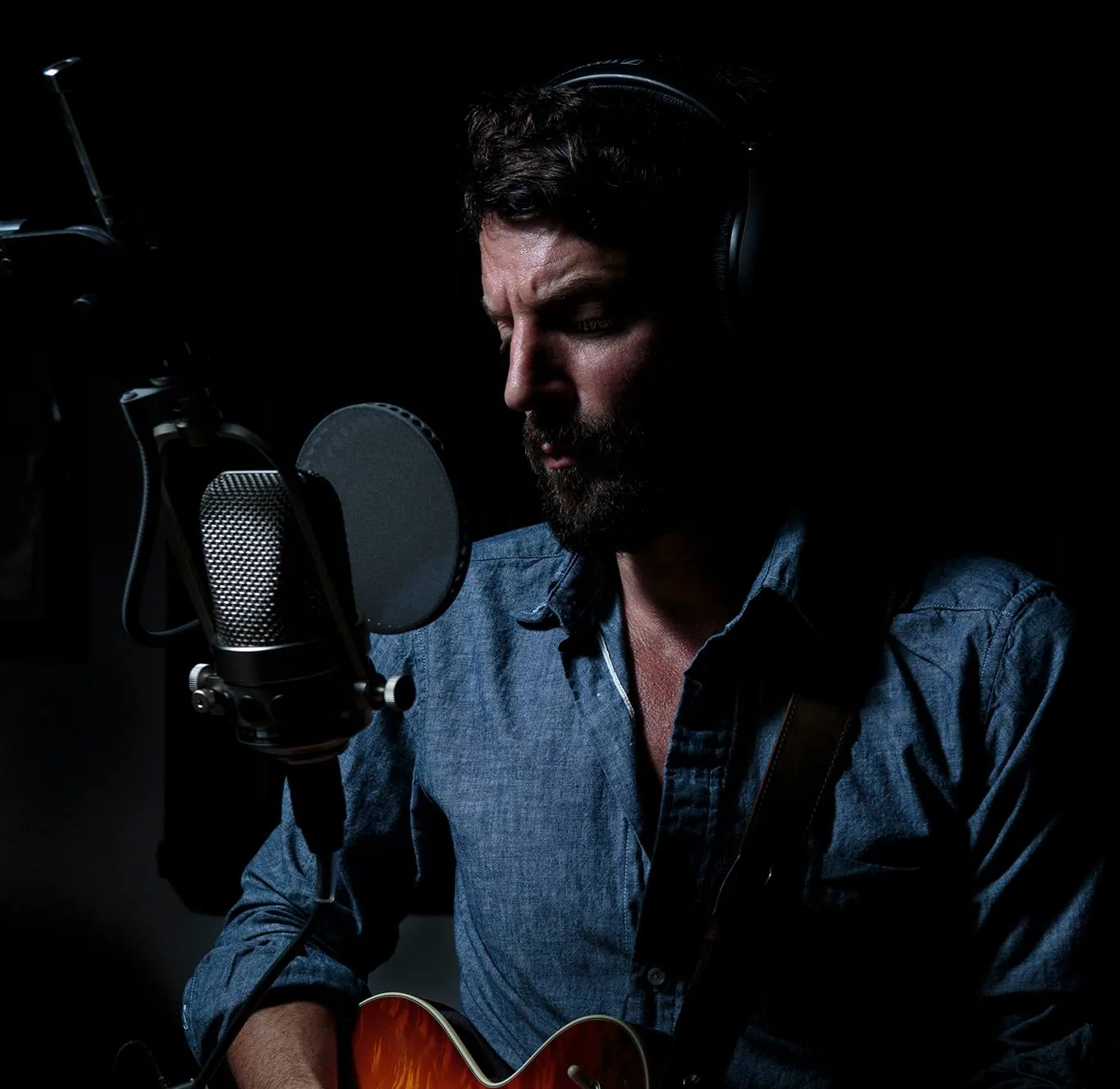 Ray LaMontagne performing onstage at the Ryman Auditorium in Nashville