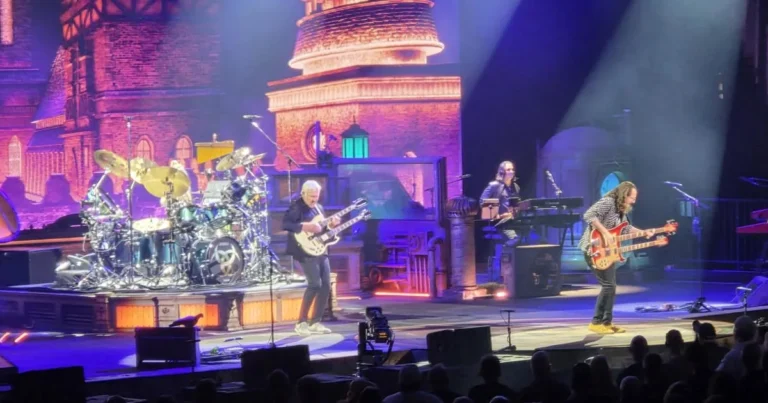 Rush performs at Rocket Arena in Cleveland during the Fifty Something tour with fans in vintage shirts