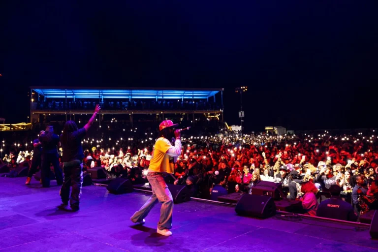 Chief Keef performs onstage at Huntington Bank Pavilion in Chicago with fans watching from the crowd