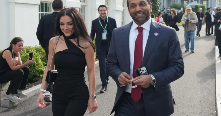 Kash Patel and Alexis Wilkins pose together in a black-and-white engagement photo