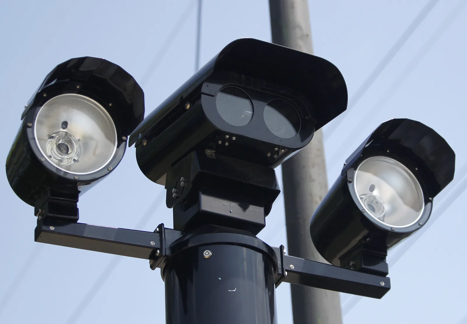 Red-light camera mounted at a Chicago intersection beside a traffic signal