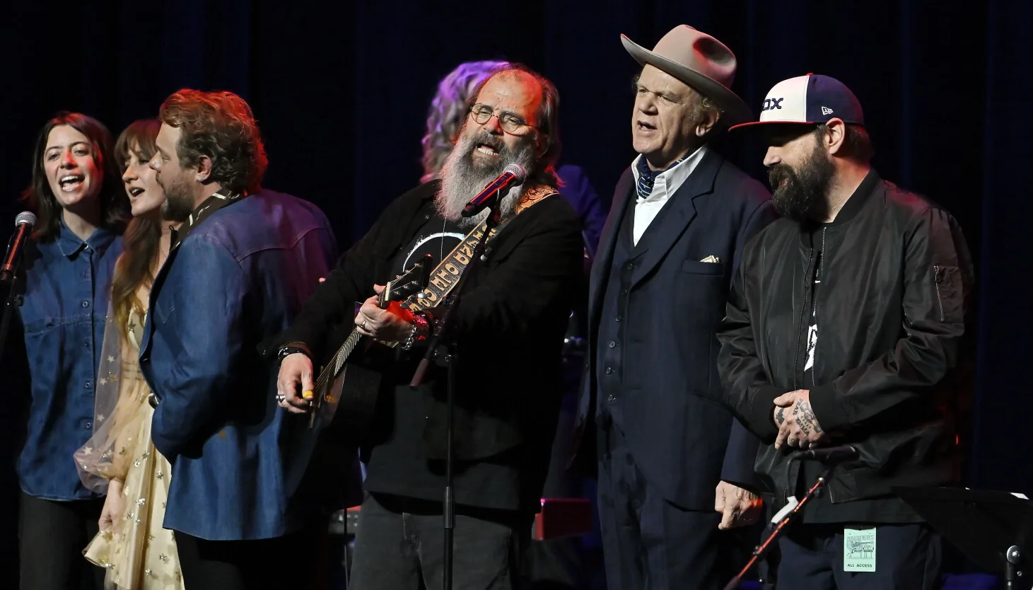 Performers gather onstage at the Chicago Theatre for a John Prine tribute concert