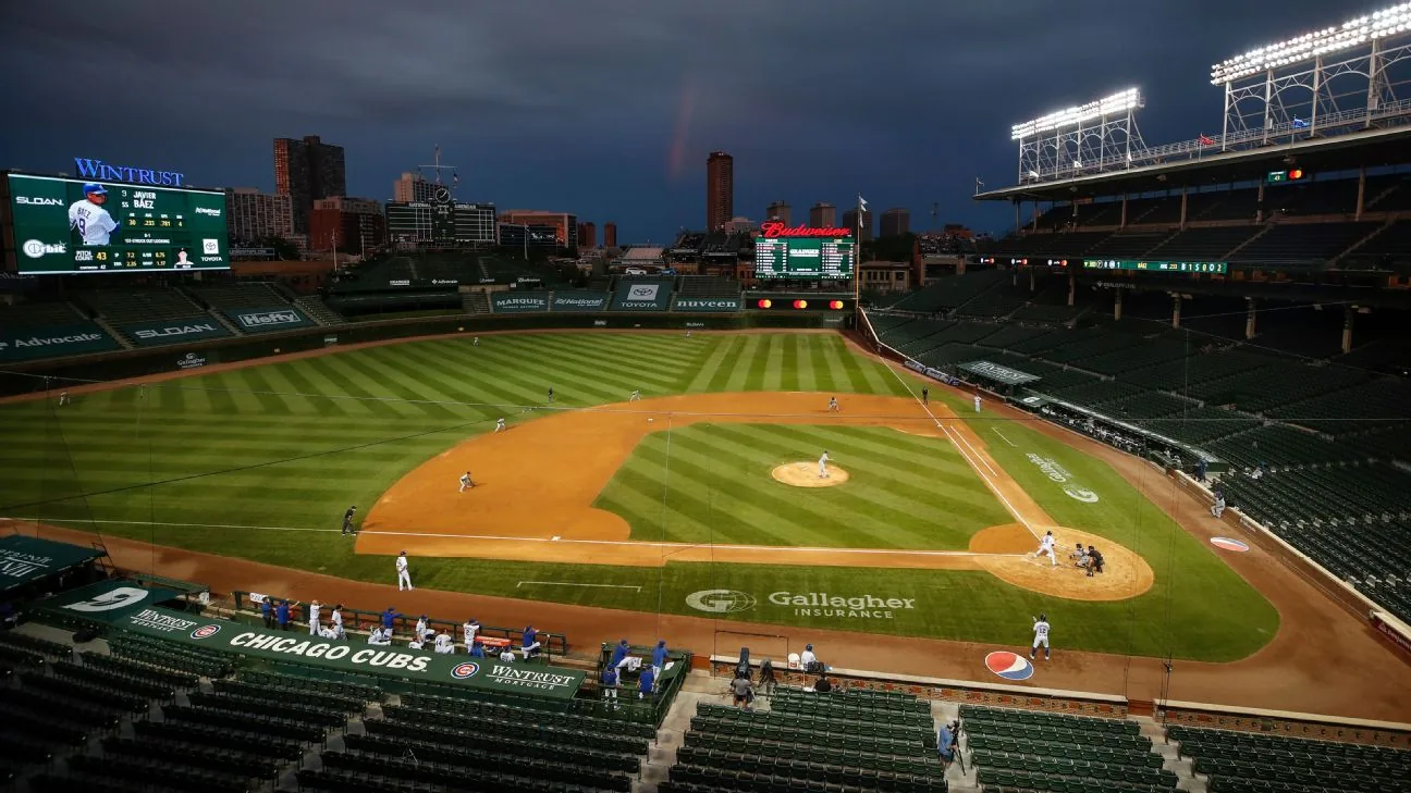 Wrigley Field with rooftop buildings visible beyond the outfield in Chicago